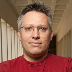 headshot of a white man with gray-brown hair and a red shirt: Delmar Larsen